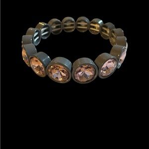 Beautiful women’s stretch bracelet with beautiful pink stones. Gray band. NWOT.